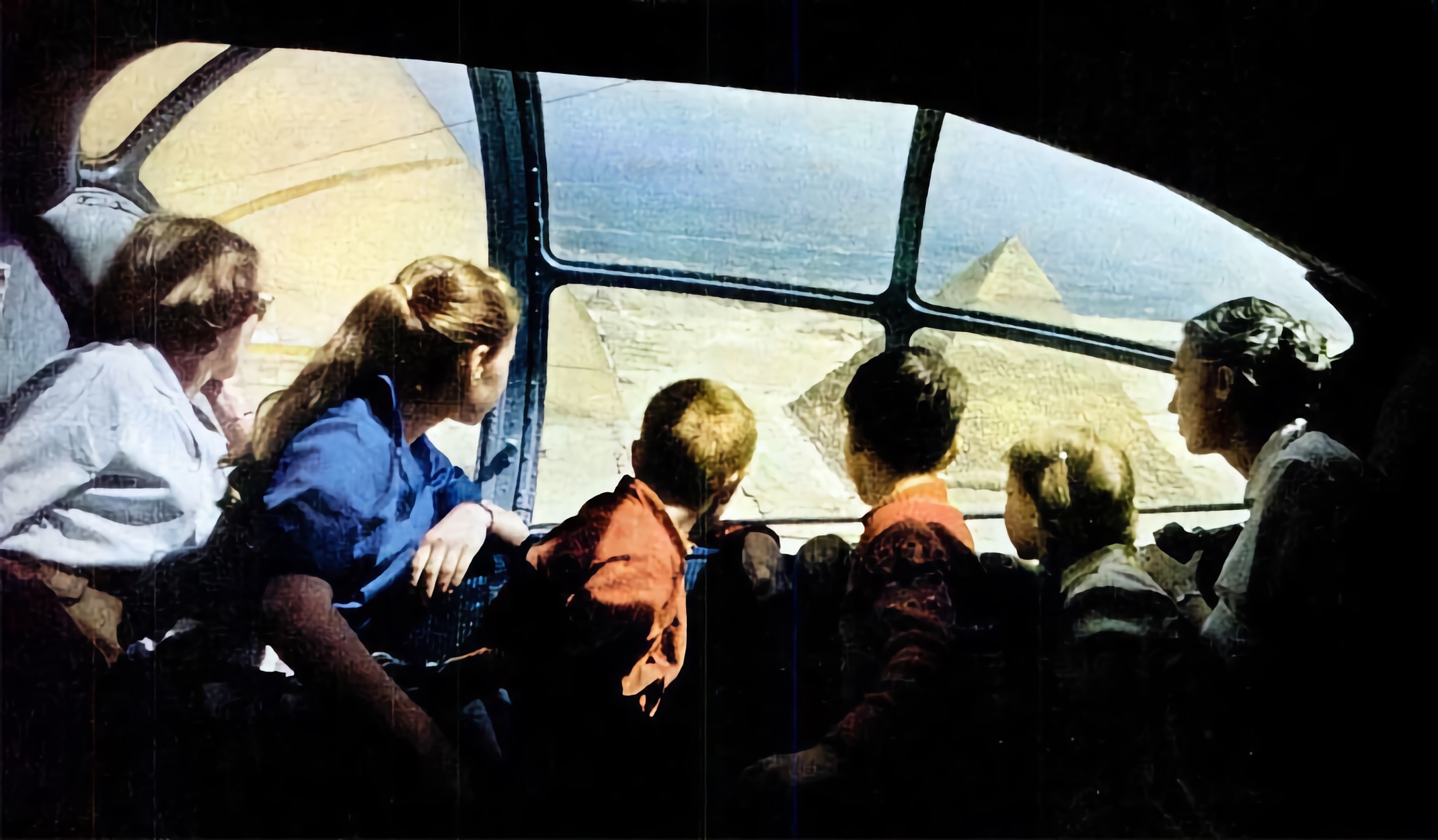 The starboard observation blister, formed of a single piece of Perspex, displayed the world in panorama. Here, the Kendall family in N5593V, joined by LIFE photographer David Lees, observes the great pyramids.